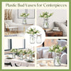 A collection of clear plastic bud vases for centerpieces, showcasing various glass and crystal designs.