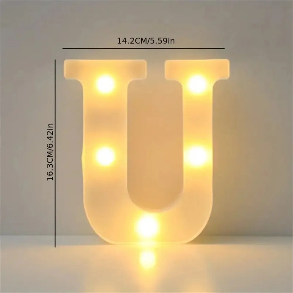 A glowing yellow letter U made of LED lights, used for cozy room or party decor.