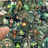 A close-up of a hand holding a witch-themed sticker pack featuring forest witches and decorative elements.
