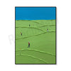 Abstract canvas art depicting a bright green, rolling golf course under a clear blue sky with small figures playing.