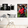 A framed canvas wall art featuring a portrait of Tiger Woods in a red shirt.