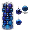 A box containing 24 blue and purple festive Christmas tree ornament balls.