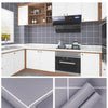 A close-up view of 50-degree waterproof oil-proof kitchen wallpaper rolls and installed panels.