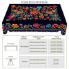 A vibrant Mexican carnival printed tablecloth featuring colorful flowers and foliage on a dark background.