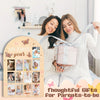 A mother and daughter pose with a gift box and a milestone board showing photos for a baby's first year.
