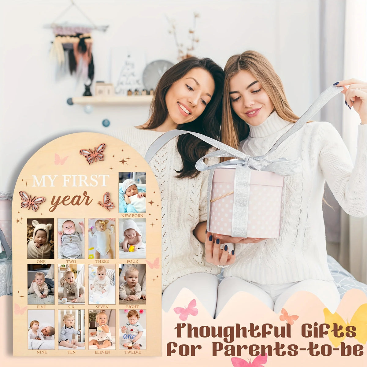 A mother and daughter pose with a gift box and a milestone board showing photos for a baby's first year.