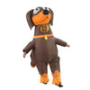 An inflatable dachshund dog costume for adults, brown and orange, with a visible face.