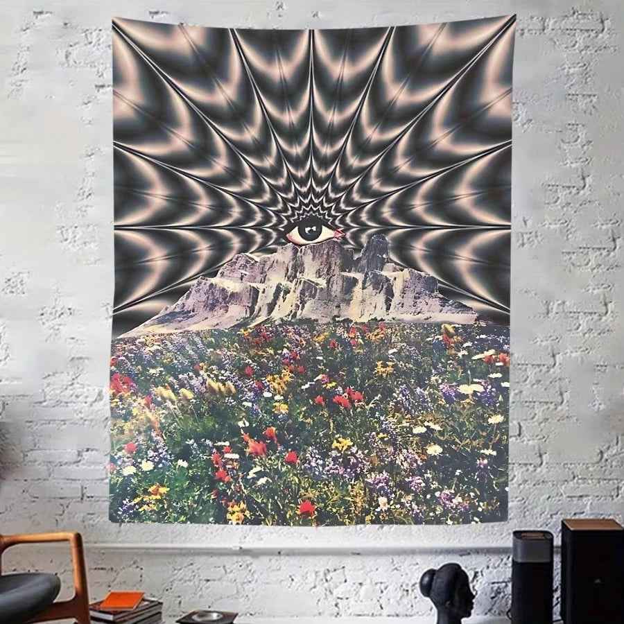 Wall tapestry featuring a psychedelic eye radiating light over a mountain landscape covered in colorful flowers.