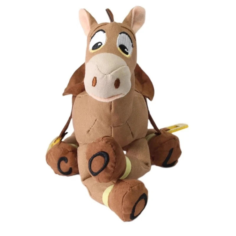 Juguete de peluche de caballo marrón con ojos grandes y hocico color canela clara.