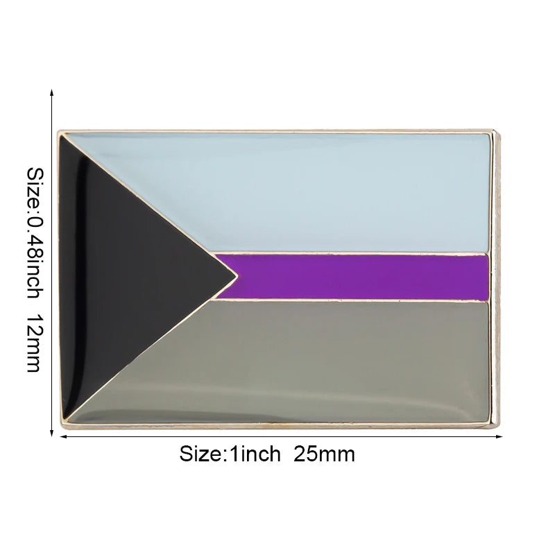 A lapel pin featuring a geometric design with black, purple, and light blue sections.