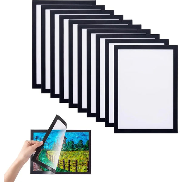 A set of three black minimalist magnetic photo frames with a landscape photograph displayed in the bottom frame.