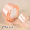 Roll of pink silk satin ribbon for gift wrapping and craft projects