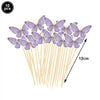 Ten purple butterfly toppers on wooden sticks for cupcakes and parties