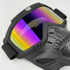 A close-up view of a black offroad full face skull riding goggle with a reflective lens.