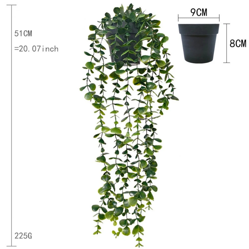 A long, cascading artificial plant wall decor featuring green foliage, displayed next to a potted version.