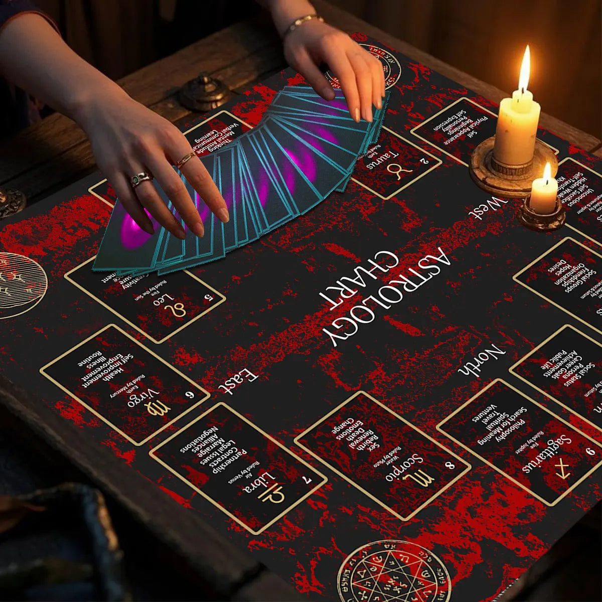 Hands place a glowing purple Celtic cross altar cloth on a dark table with candles and astrological charts.