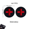 Two black embroidered medical cross tactical morale patches, 5cm in size.