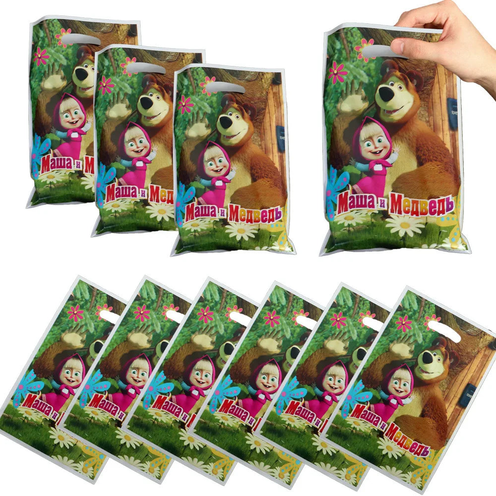 A set of Masha and The Bear birthday party supplies including balloons, plates, and cups in a decorative packaging.