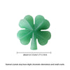 A green natural aventurine quartz four-leaf clover crystal statue.