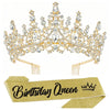 A gold-toned rhinestone tiara crown and a matching birthday queen sash on a gold ribbon.