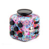 A colorful fidget cube with a floral pattern and a black lid.