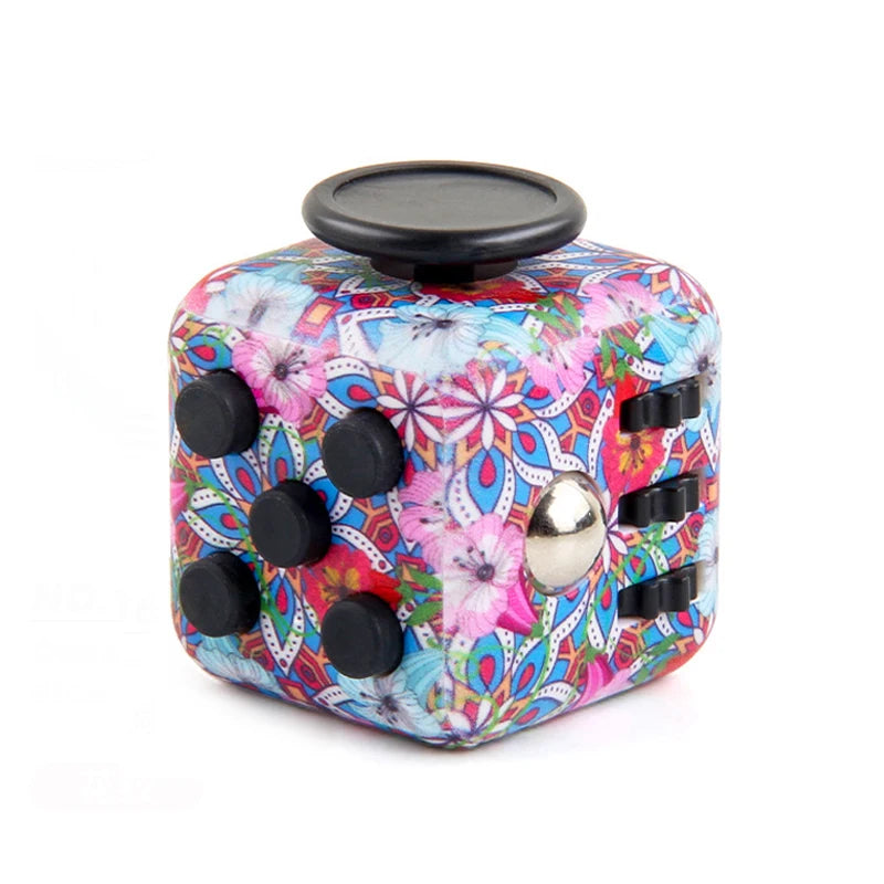 A colorful fidget cube with a floral pattern and a black lid.