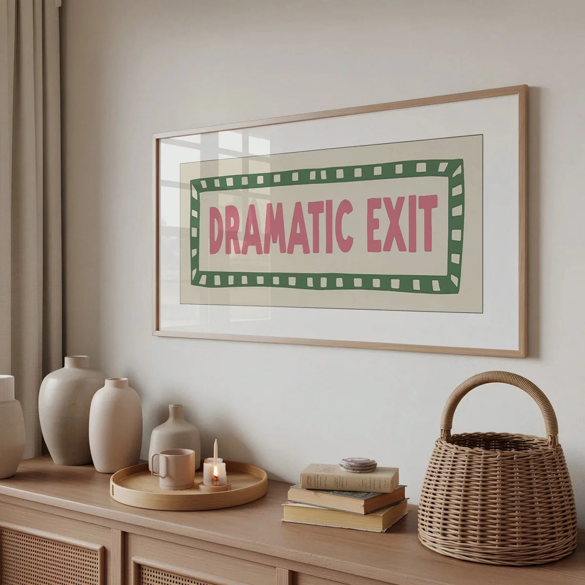 A framed canvas print featuring the text Dramatic Exit in pink and green on a light background.