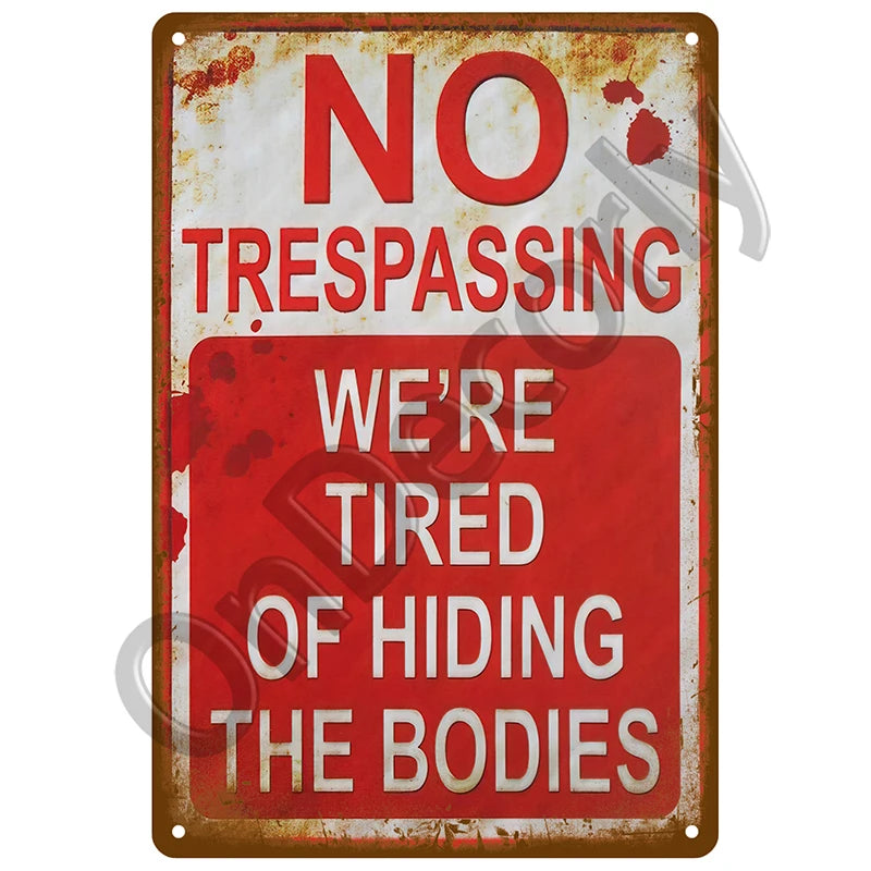 A vintage metal sign with red and white text warning against trespassing and hiding bodies.