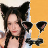 A woman wearing a black cat ear headband and a black bow choker set against an orange background.