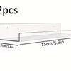 Two clear acrylic floating storage racks shown with dimensions 4.5cm/1.7in high and 15cm/5.9in long.