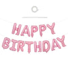 A set of pink foil balloons spelling out HAPPY BIRTHDAY for a celebration.