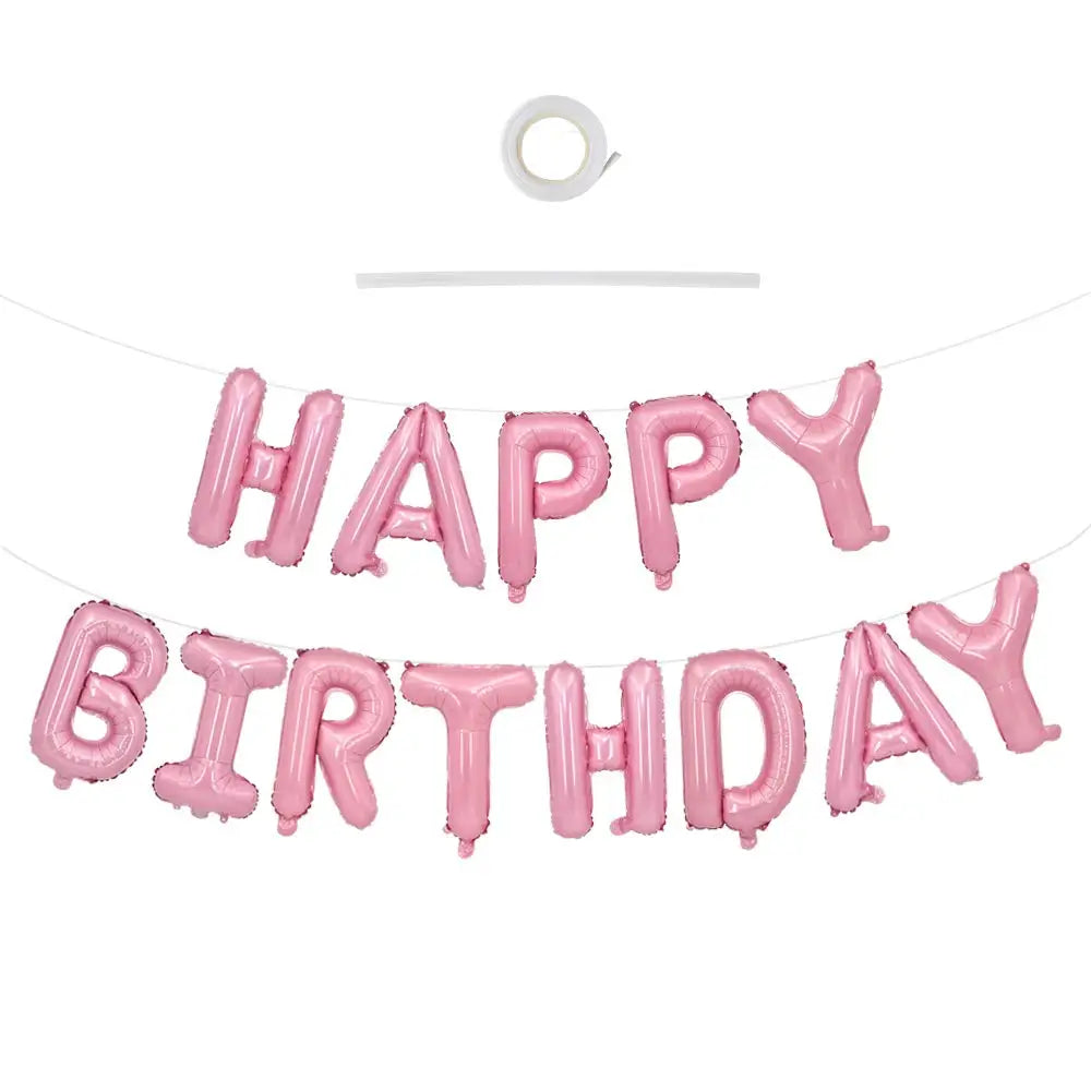 A set of pink foil balloons spelling out HAPPY BIRTHDAY for a celebration.