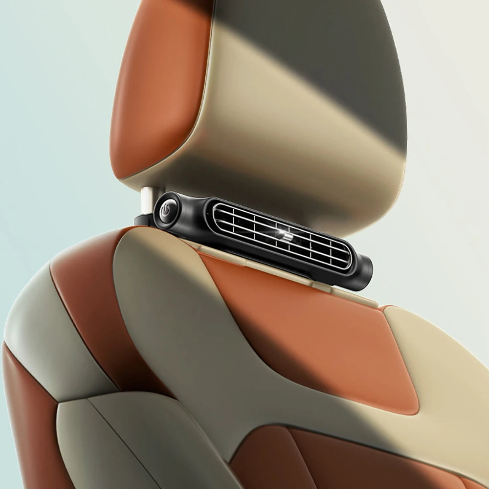 Close-up view of a car backseat cooling fan with three speed settings installed in the interior panel.