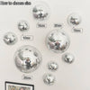 Various sizes of silver disco balls are displayed with measurements ranging from 10cm to 25cm.