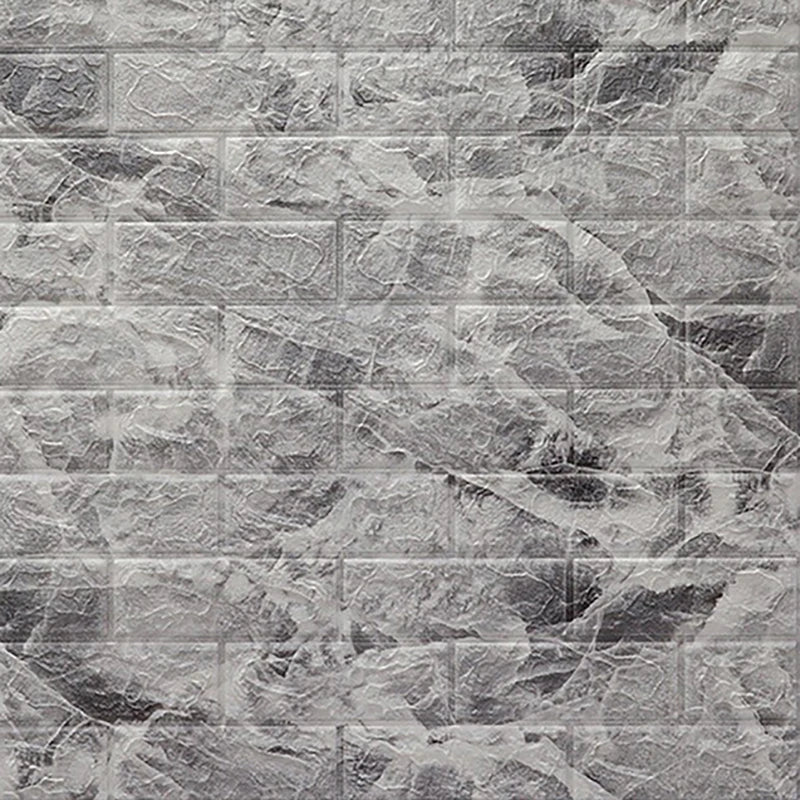 Gray stacked stone wall panels with natural veining and texture for home decor