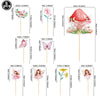 A set of nine fairy cupcake toppers featuring various floral and butterfly designs on wooden sticks.