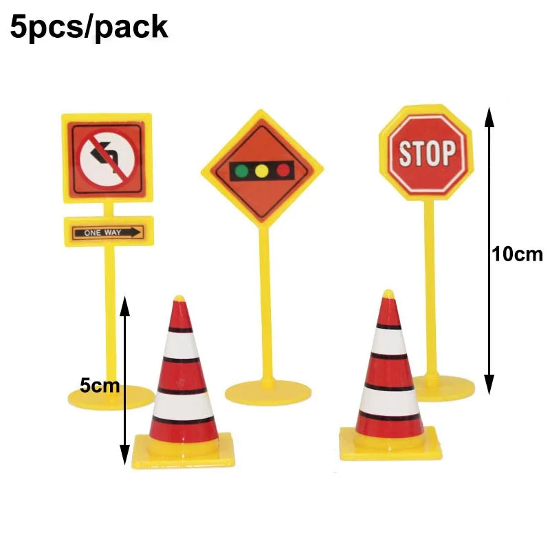 A set of construction vehicle cake toppers including an excavator, crane, and stop road signs.
