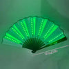 A green folding LED fan with light rays is shown, angled upwards.