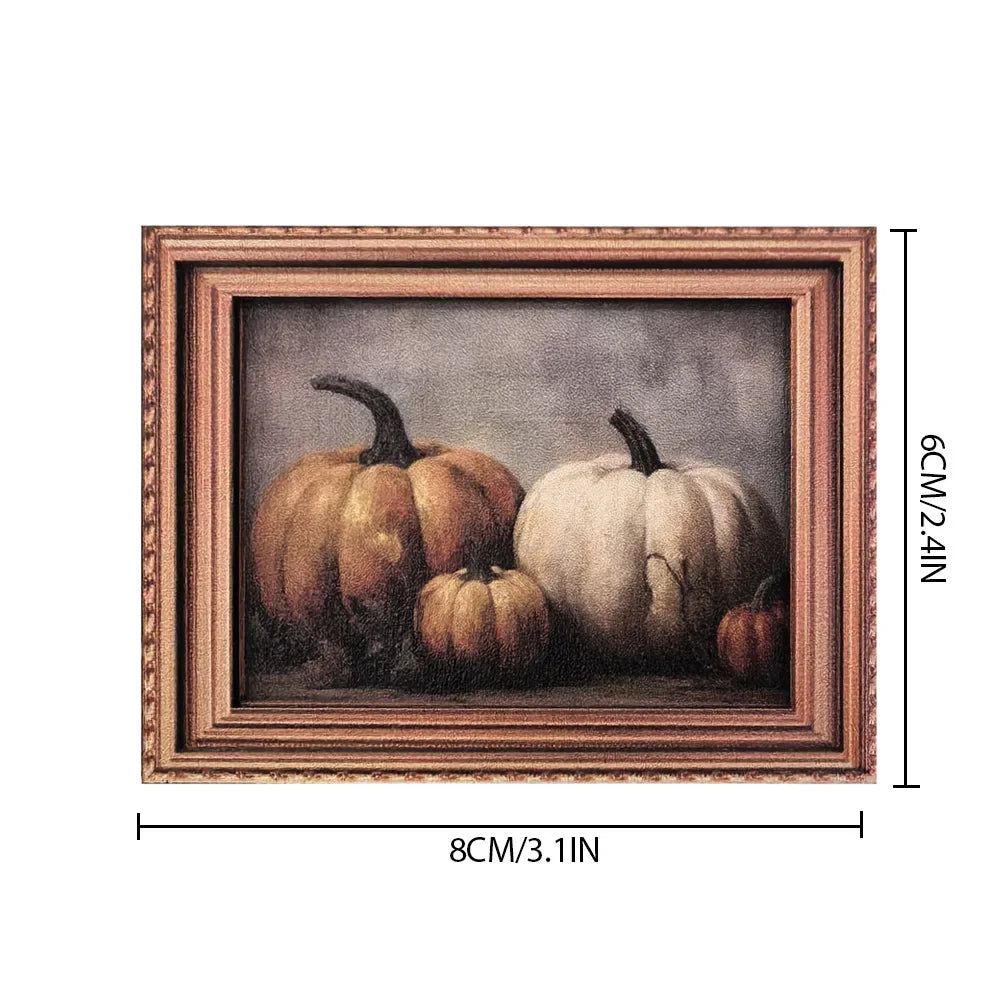 A framed painting featuring two pumpkins in a rustic wooden frame.