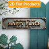 A vintage metal street sign decor with the text Welcome to my happy place don't ruin it mounted on a white wall.