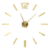A modern 3D acrylic wall clock with DIY sticker numbers and gold-toned hands.
