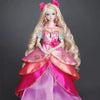A ball-jointed doll dressed in a pink and magenta gown with floral accents and pink hair