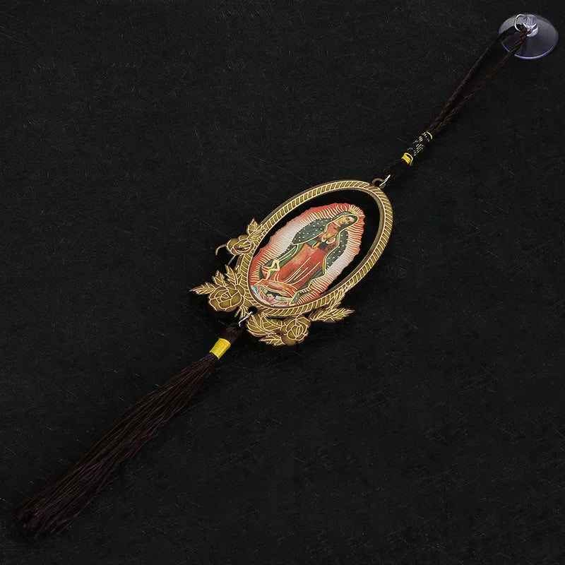 A wooden Our Lady of Guadalupe pendant charm with a gold-colored frame and dark brown cord.