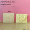 A rectangular silicone mold shaped like a handbag is shown against a pink background.