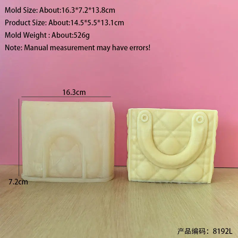 A rectangular silicone mold shaped like a handbag is shown against a pink background.