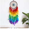 A decorative pendant featuring a black mesh dream catcher with colorful feathers in shades of orange, yellow, green, and blue