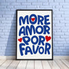 A framed canvas print featuring the text MORE AMOR POR FAVOR in bold blue letters with red hearts on a white background.