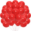 A cluster of red latex balloons floating against a white background.