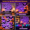 3D glowing bat wall decor for Halloween featuring various bat silhouettes and seasonal decorations
