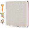 A linen scrapbook photo album with self-adhesive pages shown next to a wooden tool and colorful paper samples.